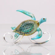 Fins / Head  opaque light blue, shell color offered in dark blue, ashes in belly, wave paperweight
